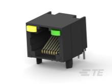 Connettore RJ45 nero e giallo con multipli contatti metallici per la trasmissione dati e piedini di fissaggio per il montaggio.