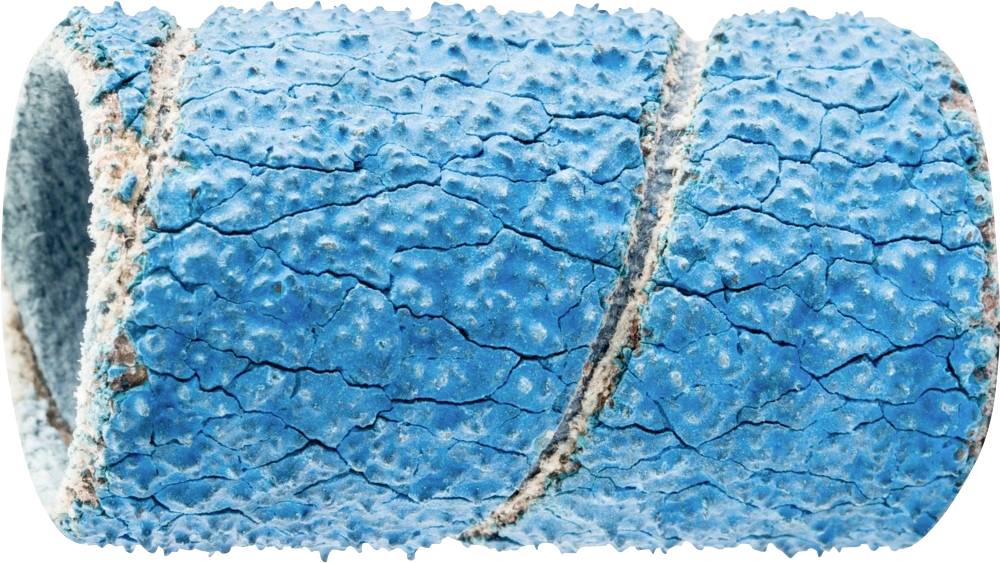 Primo piano di una superficie blu strutturata, dall'aspetto screpolato e usurato. La texture appare ruvida e irregolare.