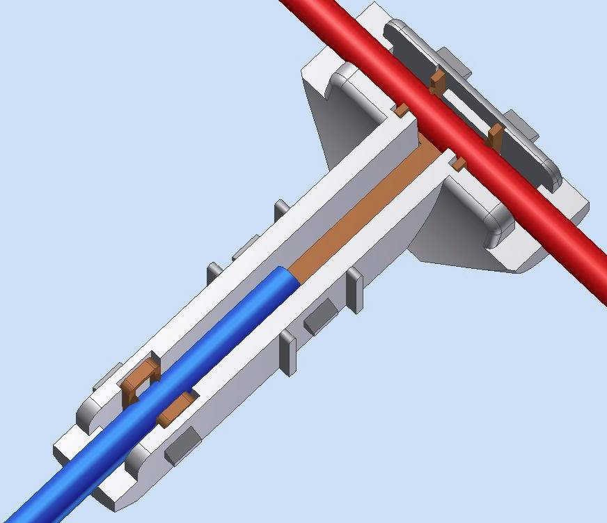 Diagramma di un connettore che mostra come un cavo blu passi attraverso un adattatore bianco, incontrando un cavo rosso.