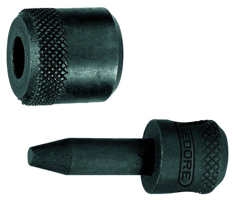 Due utensili metallici neri: Un timbro rotondo con punta appuntita e un pezzo cilindrico con bordo scanalato.