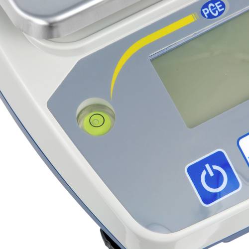 Primo piano di un dispositivo tecnico con schermo e comandi; freccia gialla e simboli di accensione e spegnimento visibili.