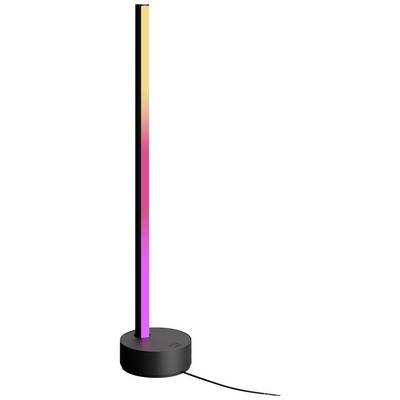 Una sottile lampada LED a colonna con fascio luminoso a cambiamento di colore, poggiante su un piedistallo nero rotondo.