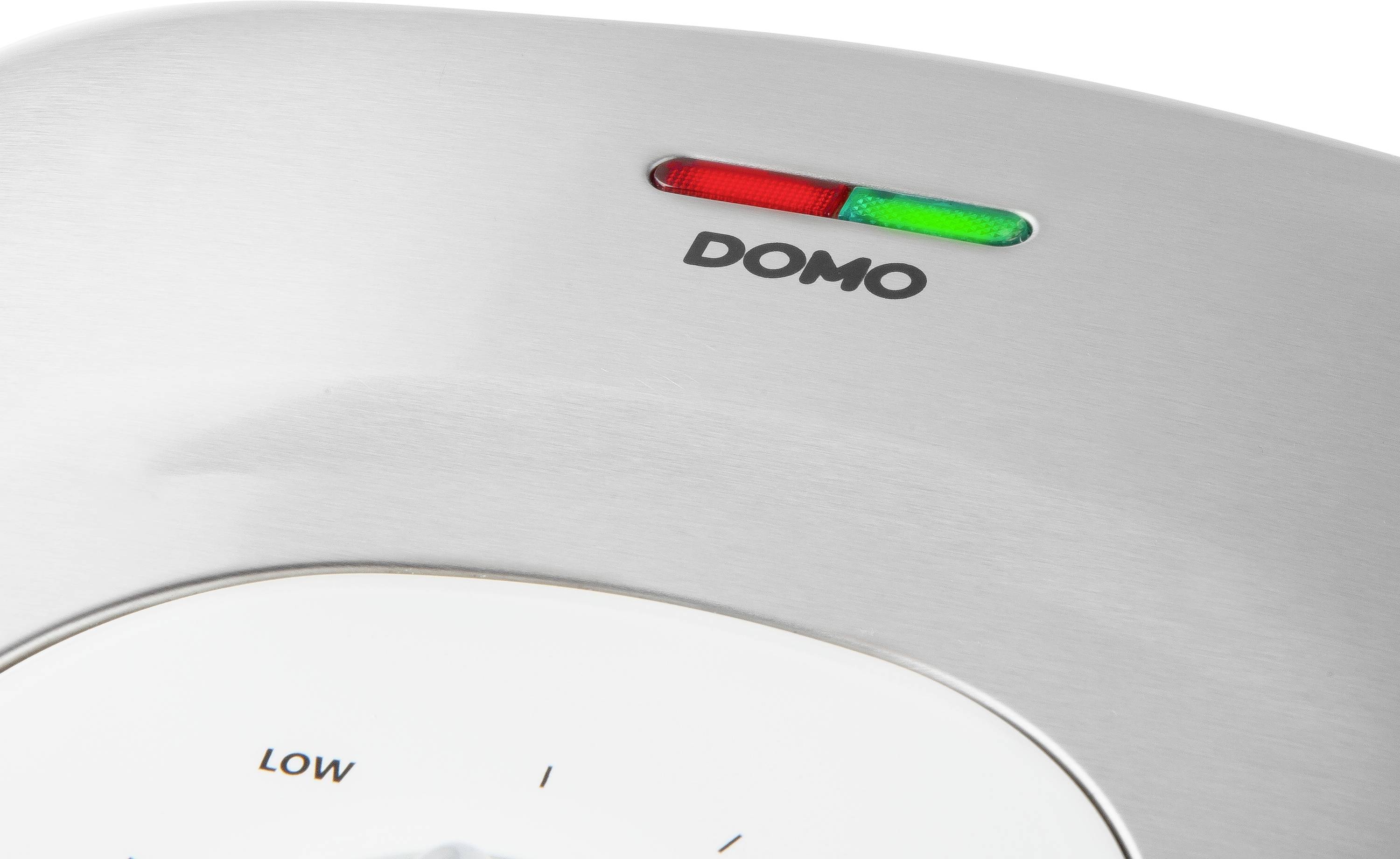 Un dispositivo con un'indicazione dello stato operativo: una luce verde illuminata e una rossa. Marchio 'DOMO' visibile accanto alle luci.