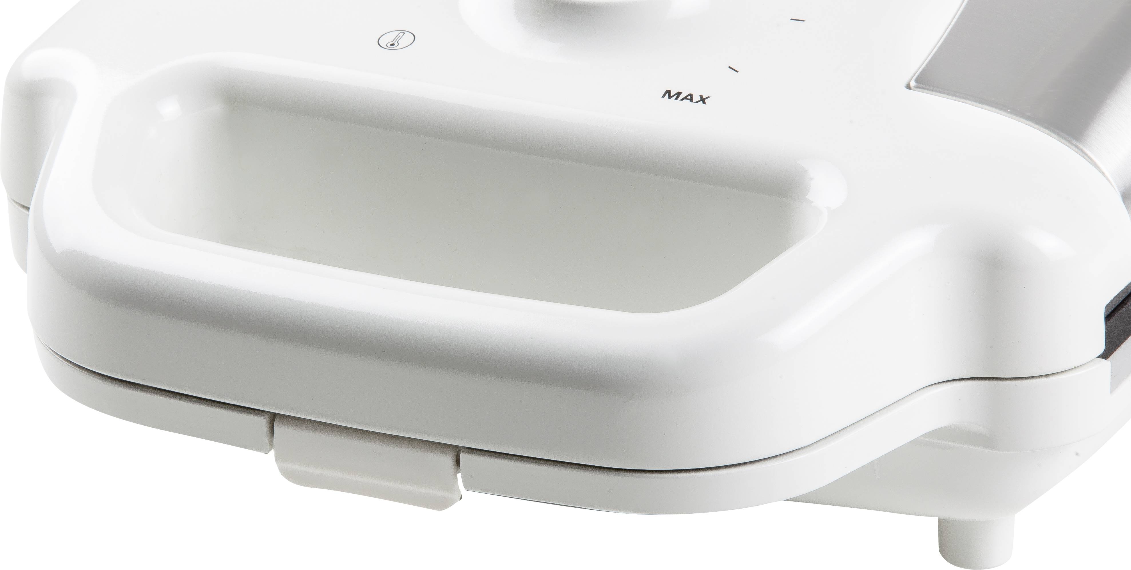 Un elettrodomestico bianco da cucina con design arrotondato. Un segno "Max" indica un'impostazione.