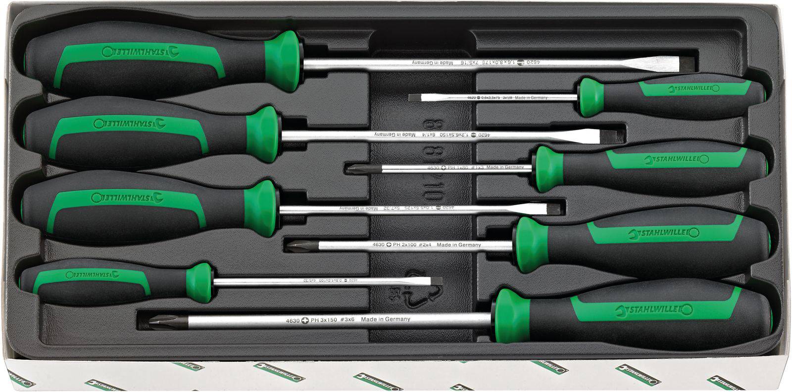 Un set di otto cacciaviti con manici neri e accenti verdi in una scatola, ordinati per dimensione.