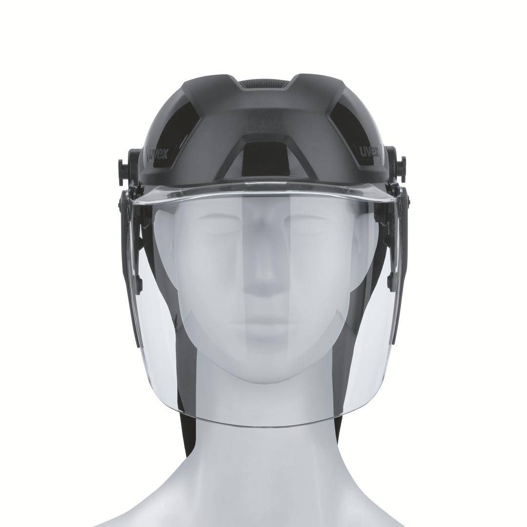 Casco protettivo con visiera, trasparente e nero, montato su un manichino grigio. Offre protezione facciale in ambienti di lavoro.