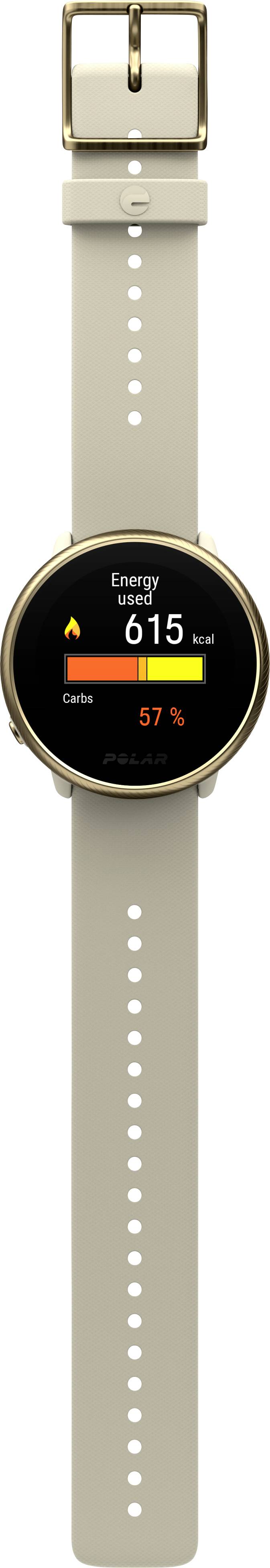 Un smartwatch con cinturino beige mostra sul display 'Energia' con 615 kcal e 57% dell'obiettivo raggiunto.
