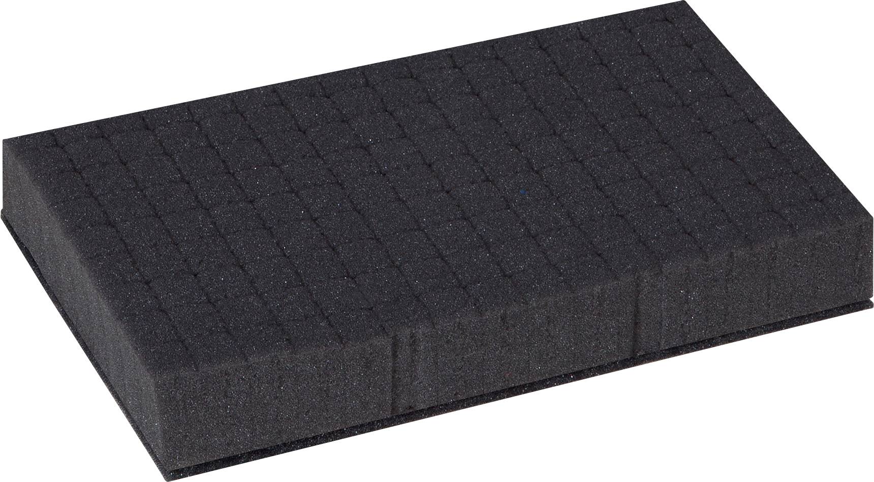 Un blocco rettangolare di schiuma nero con linee intagliate sulla superficie.