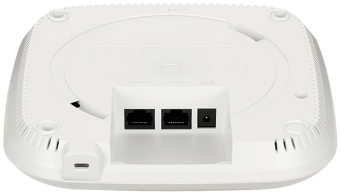 Un router WLAN bianco visto dal basso, che mostra due porte Ethernet, un ingresso di alimentazione e fessure di ventilazione circolari sul bordo.