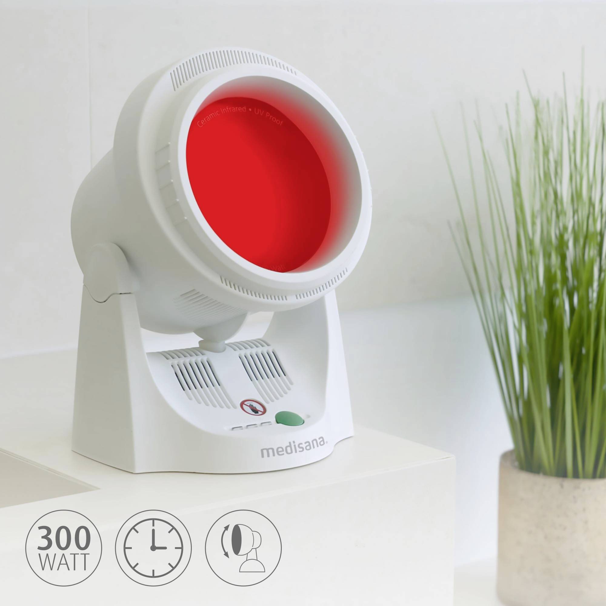 Lampada a infrarossi su un tavolo per applicazioni terapeutiche, evidenziata da simboli che indicano la potenza (300 watt) e i dettagli degli effetti.