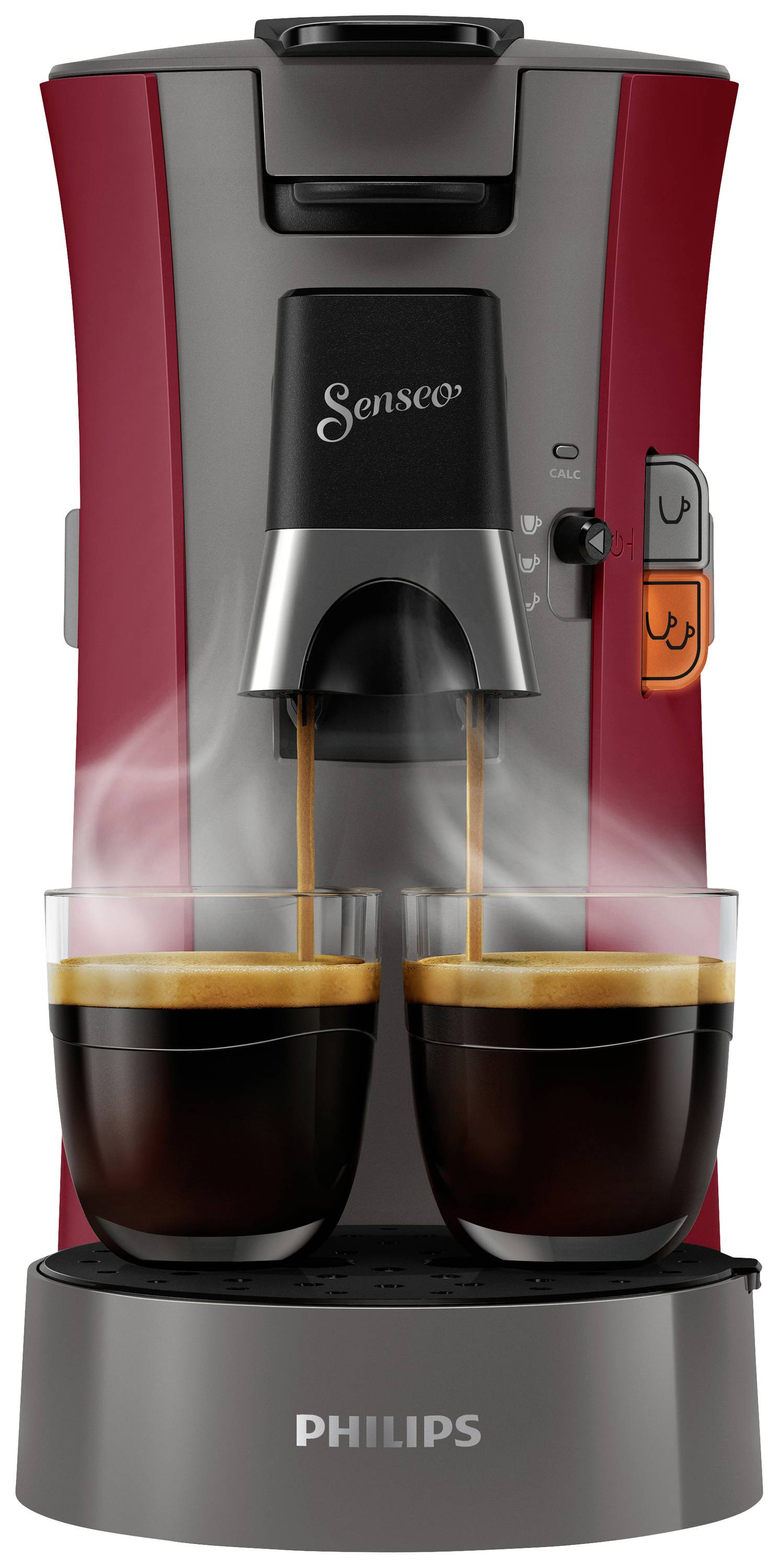 Due tazze fumanti di caffè vengono preparate contemporaneamente da una macchina per caffè Senseo con involucro rosso.