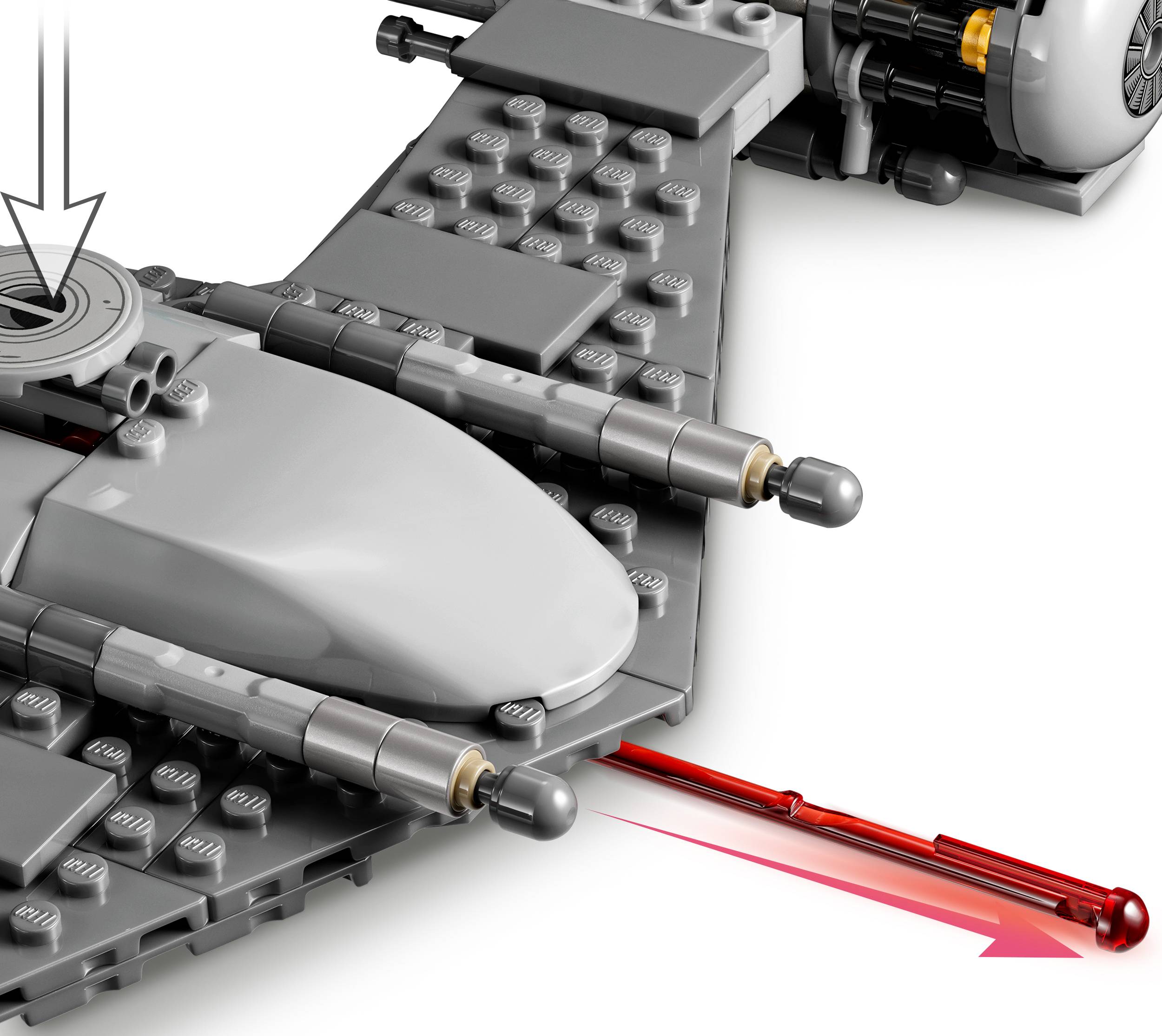 Un modello LEGO grigio, simile a un aereo, con frecce e un raggio laser, che indica una funzione o un movimento.