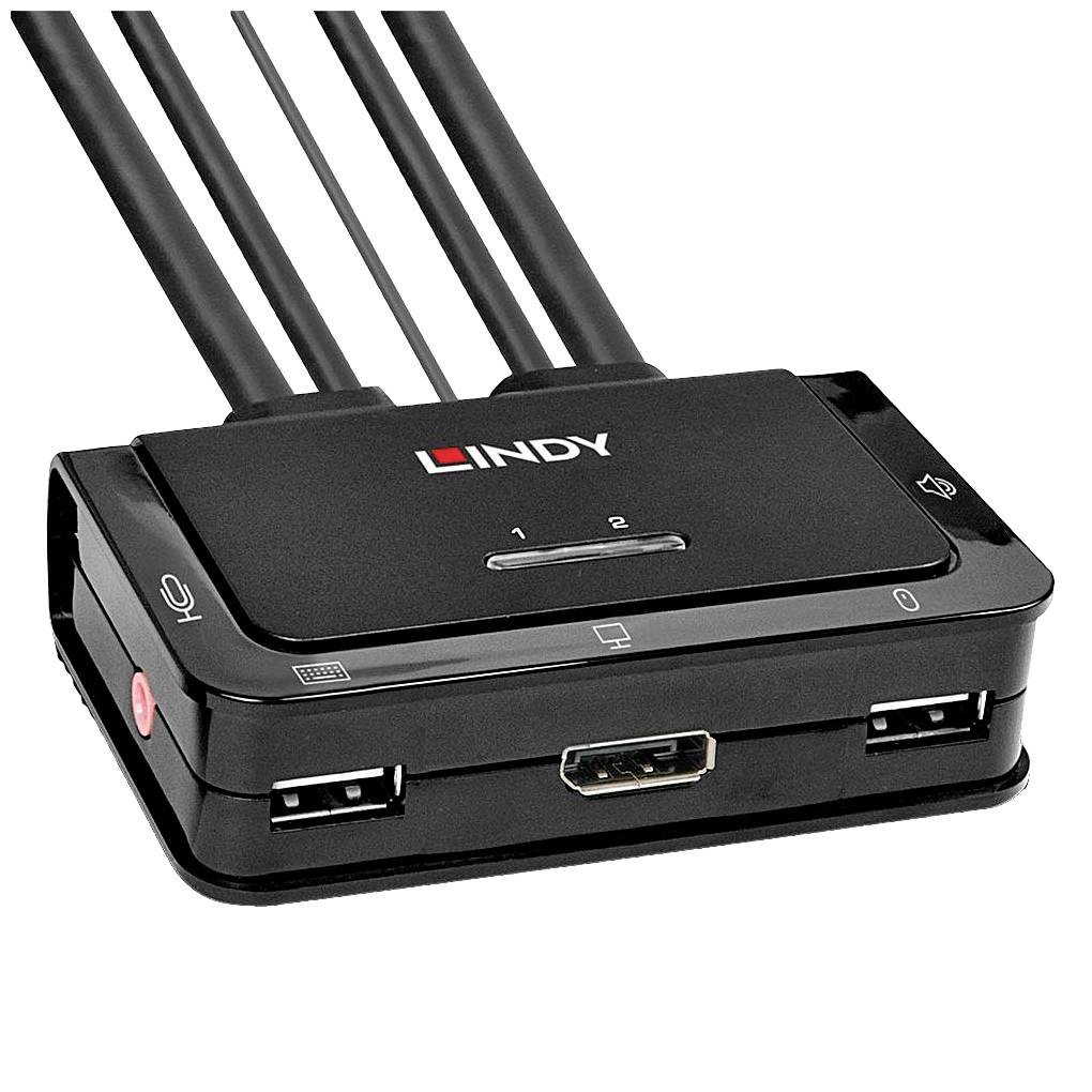 Un interruttore KVM nero con quattro cavi, due porte USB, un ingresso HDMI e un pulsante sul lato. Marchio 'Lindy' visibile.