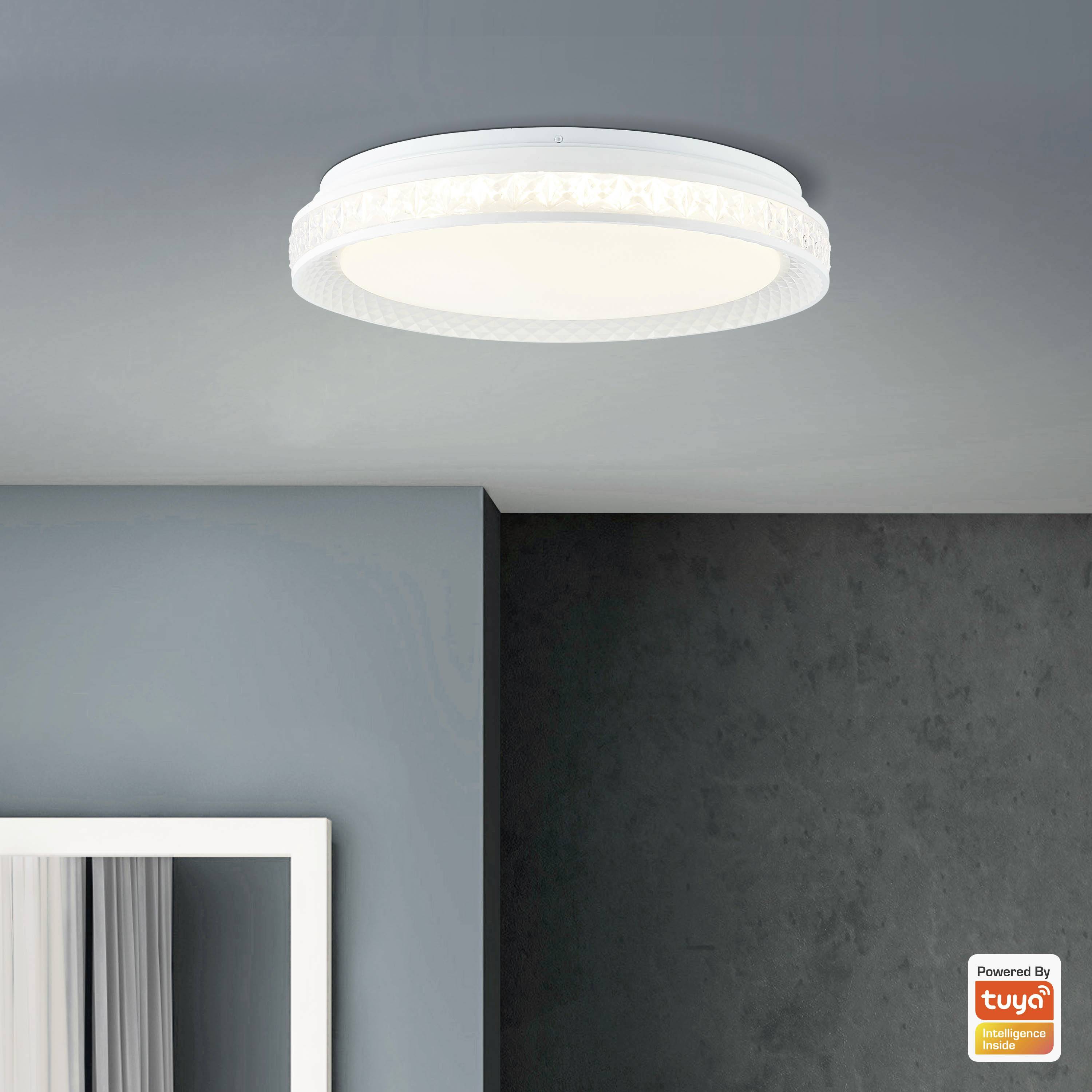 Plafoniera rotonda con design moderno fissata al soffitto di una stanza. Sullo sfondo sono visibili la parete e la cornice della finestra.