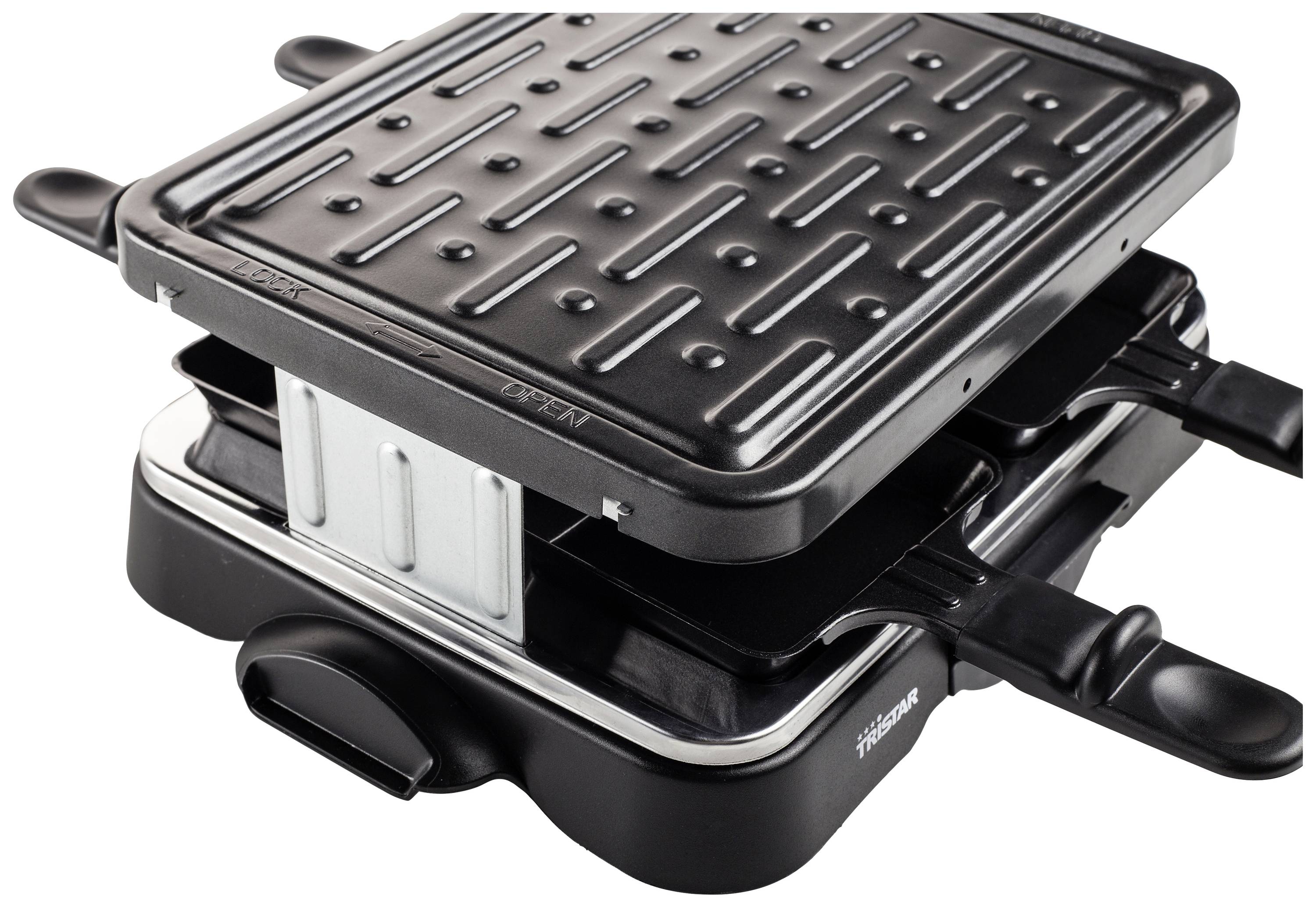 Raclette-grill con piastra antiaderente e piccole padelle sottostanti, ideale per pasti conviviali in gruppo.