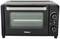 Mini forno nero con porta in vetro, regolatore di temperatura e timer, ideale per cucine piccole o spazi ristretti.