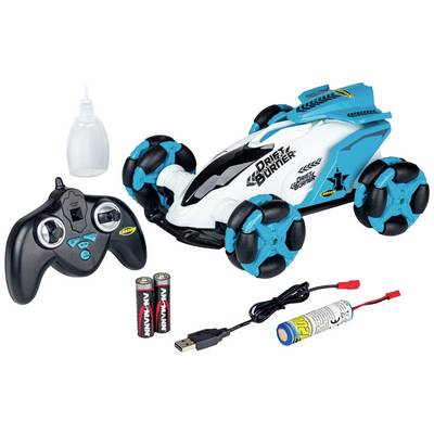 Set di macchina radiocomandata giocattolo con telecomando, batterie, caricabatterie e flacone di olio. L'auto ha una carrozzeria blu e bianca e ruote grandi.