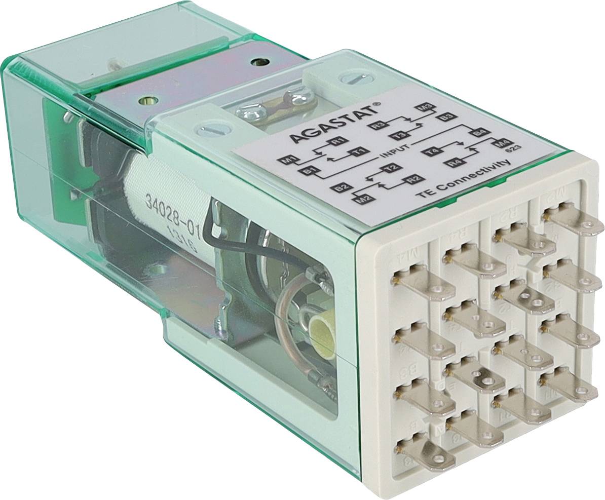 Componente relay 'Aromat' con involucro verde, etichetta superiore con diagramma di cablaggio e multipli connettori visibili. Utilizzato per circuiti elettrici.