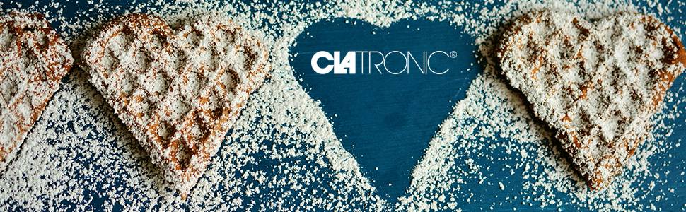Cialde a forma di cuore su sfondo blu, cosparse di zucchero a velo. Sullo sfondo appare la parola 'Clatronic'.