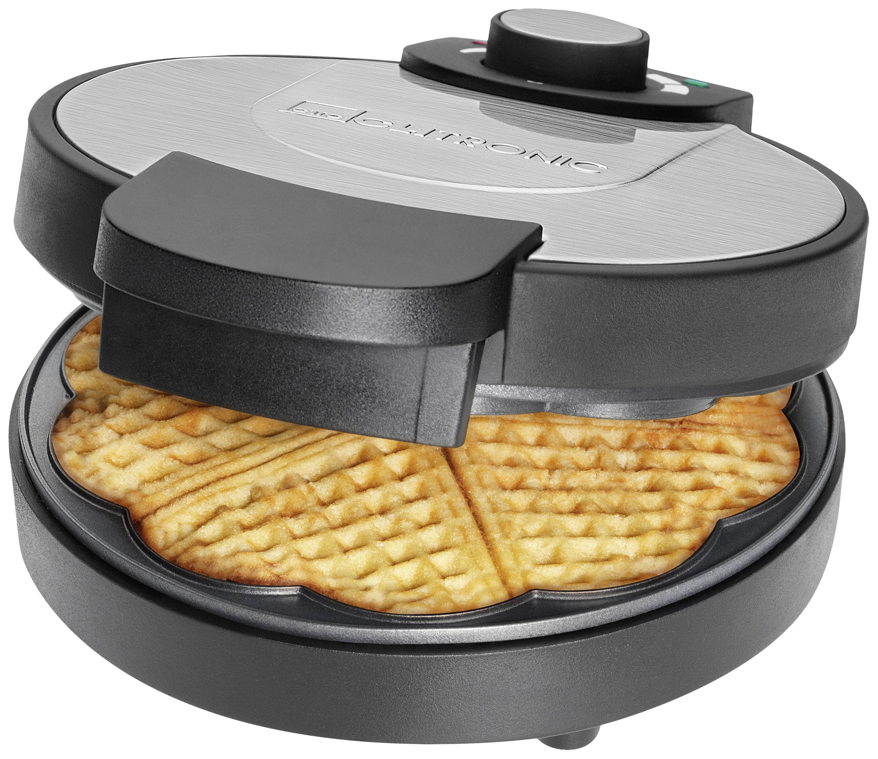 Un ferro per waffle che mostra una cialde cotta.