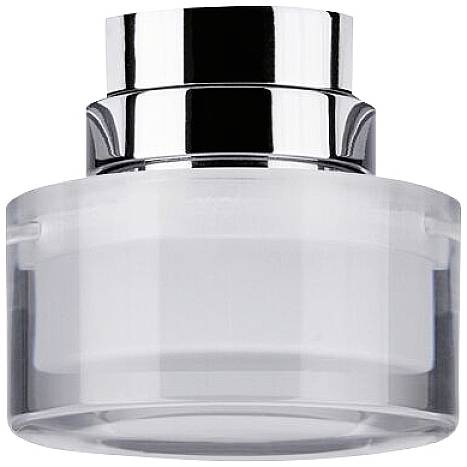 Un contenitore di vetro trasparente con coperchio argentato, comunemente utilizzato per conservare cosmetici o creme.