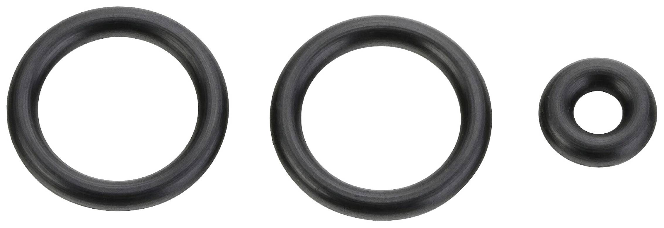 Tre anelli O-ring neri di dimensioni diverse disposti uno accanto all'altro su sfondo bianco.
