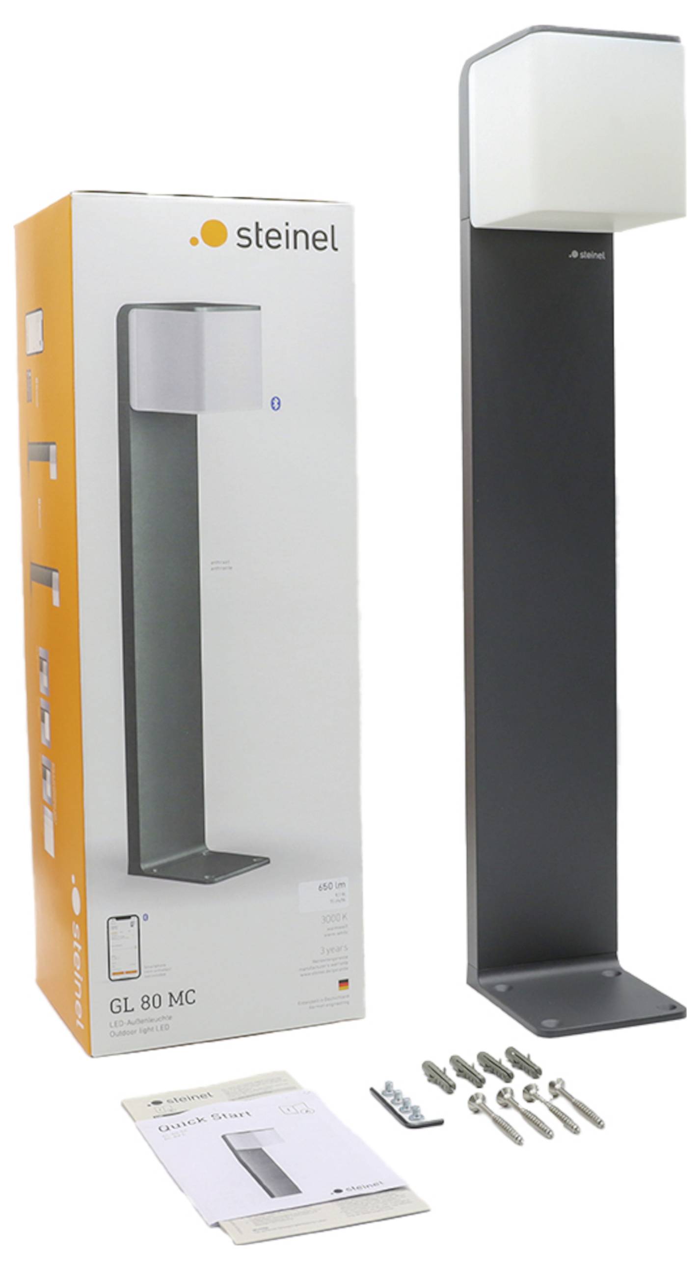 Luce per piedistallo esterno Steinel GL 80 MC mostrata con scatola del prodotto, manuale e hardware di montaggio