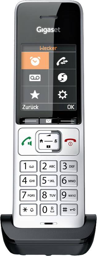 Telefono cordless con display digitale che mostra opzioni per ora e sveglia. Include tasti del volume e tastiera per l'inserimento del numero di chiamata.