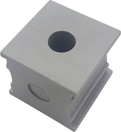 Blocco grigio in plastica a forma di cubo con un foro al centro.