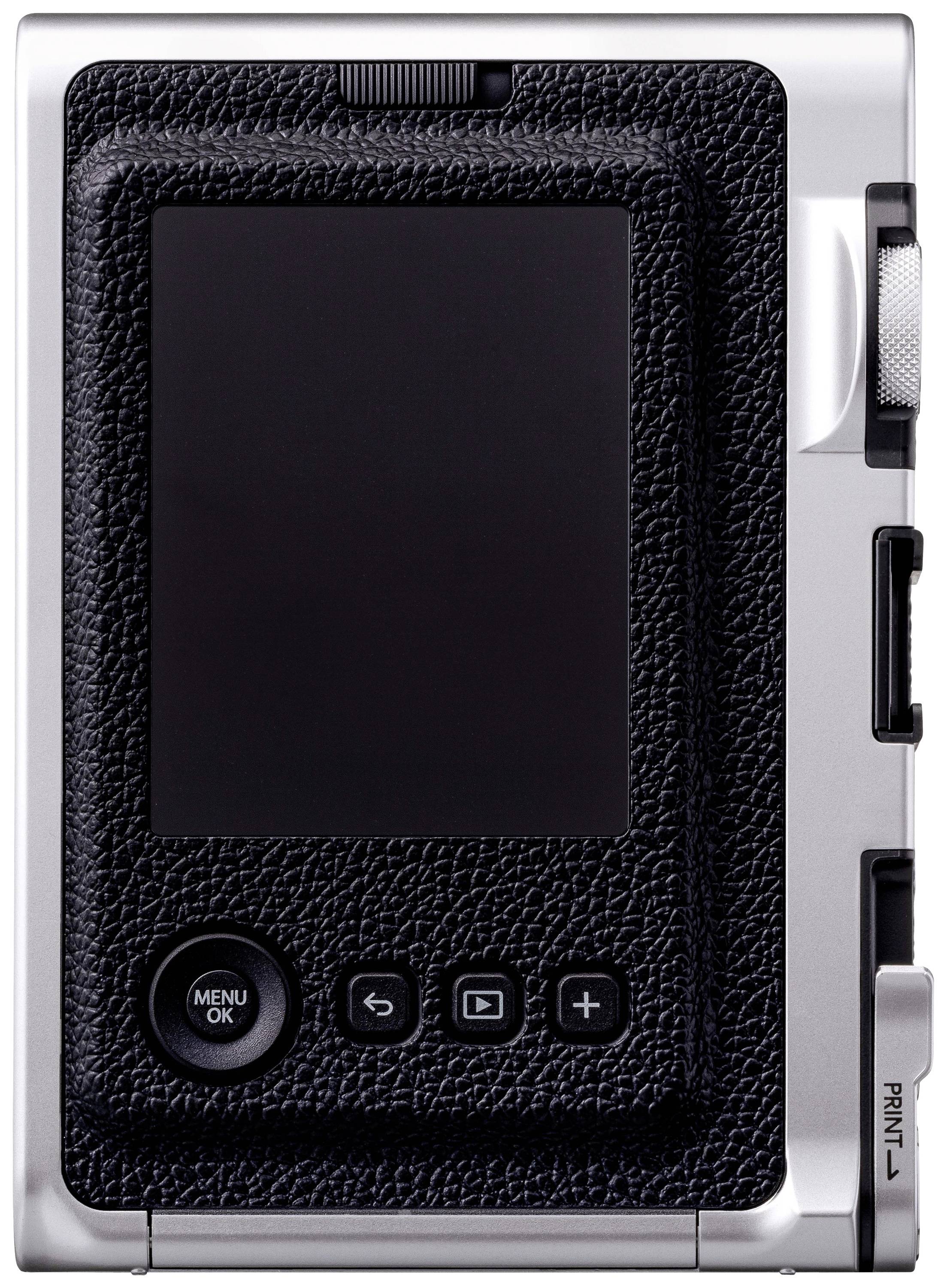 Retro di una fotocamera digitale con schermo LCD, pulsanti di menu e navigazione. Design argento e nero.