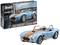 Kit modellismo Revell '65 Shelby Cobra 427', scala 1:24. Riproduce una Cobra blu con strisce arancioni, composto da 94 pezzi.
