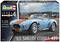 Auto modello Shelby Cobra 427 blu di Revell in scala 1:24 con strisce arancioni, raffigurato su un circuito di gara.