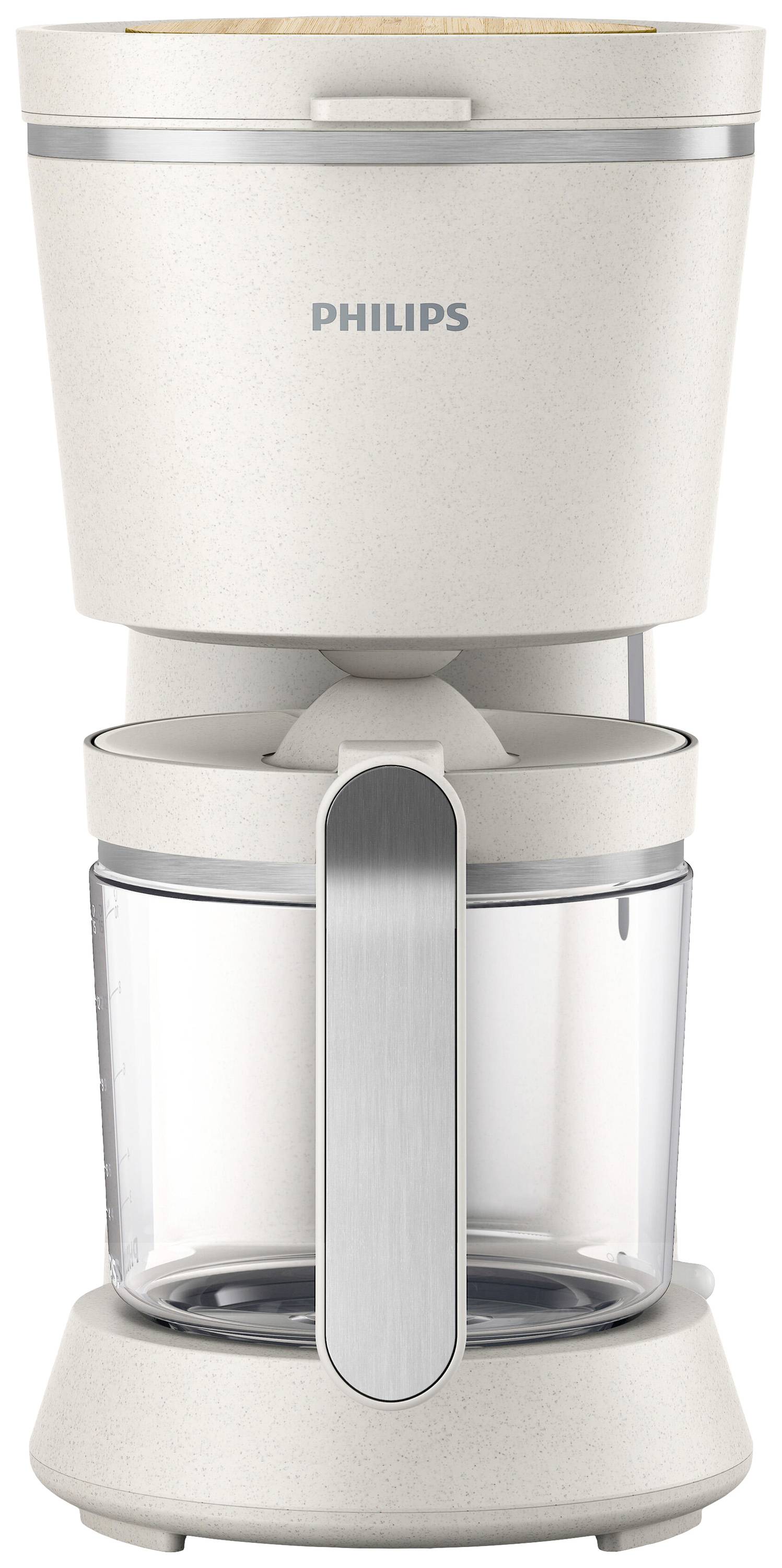 Una macchina da caffè bianca con caraffa in vetro e manico argentato. In alto è presente il logo 'Philips'. Ideale per preparare caffè filtrato.