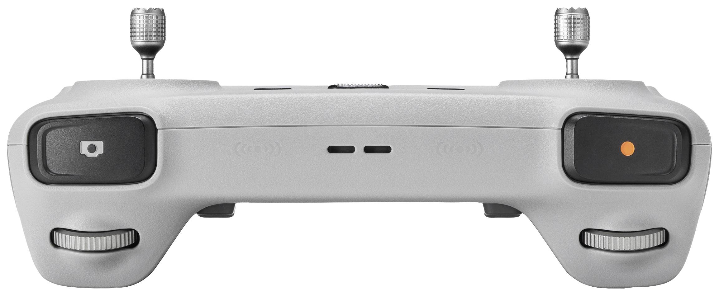 Un telecomando grigio per droni con due antenne, pulsanti di controllo e interruttori.