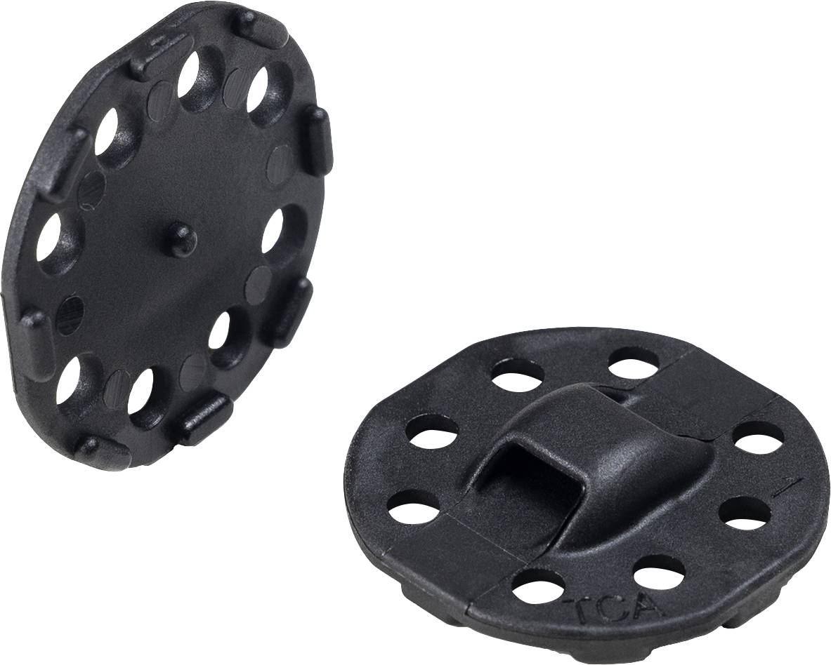 Due parti in plastica nera, ciascuna con diversi fori e un'area centrale rialzata, probabilmente destinate a scopi di fissaggio.