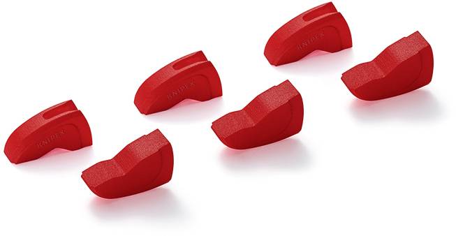 Sei graffette rosse in plastica con superficie zigrinata, distribuite uniformemente su sfondo bianco, utilizzate come strumenti di organizzazione.