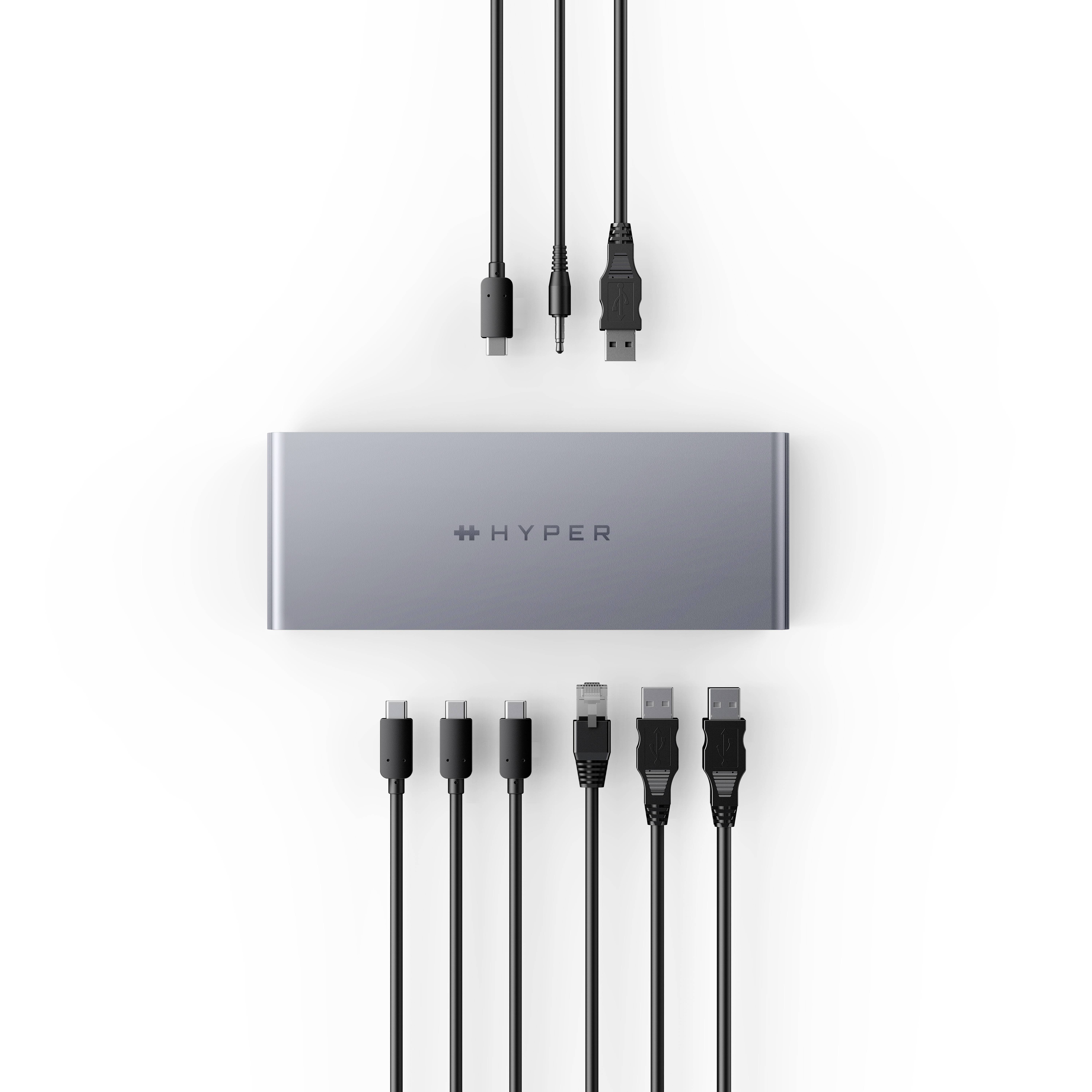 'Adattatore hub con più porte, tra cui HDMI, USB-C e USB-A, circondato dai relativi tipi di cavi. Nome del marchio al centro.'