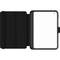 Custodia per tablet nera in plastica con chiusura a libro, aperta. Interno con scomparti per penne o carte.