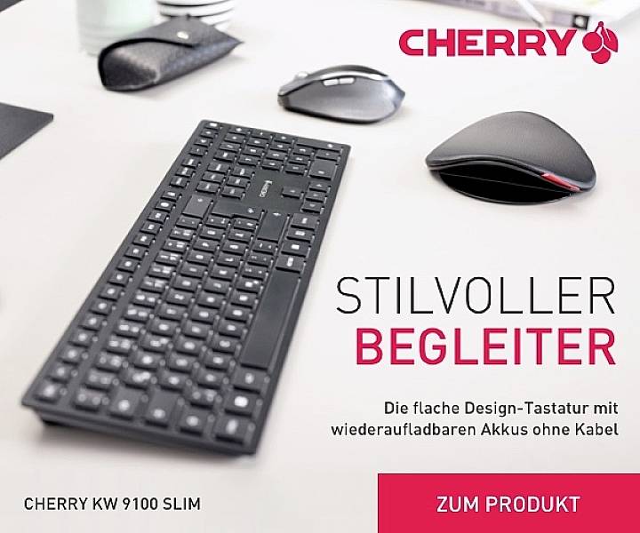 Tastiera e mouse su un tavolo. Testo: 'Compagno elegante'. CHERRY KW 9100 SLIM pubblicizzata come tastiera dal design sottile e wireless.
