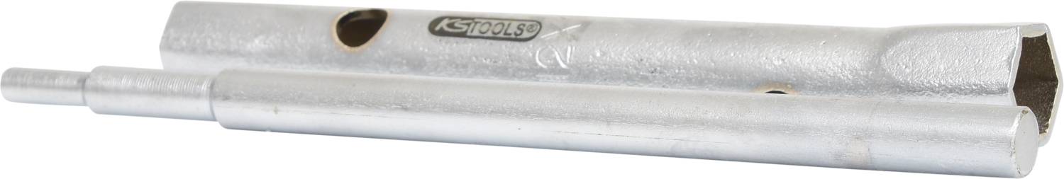 Utensile meccanico argentato in forma cilindrica composto da due parti, con fori e un'incisione recante la scritta 'ASTAHLS'.