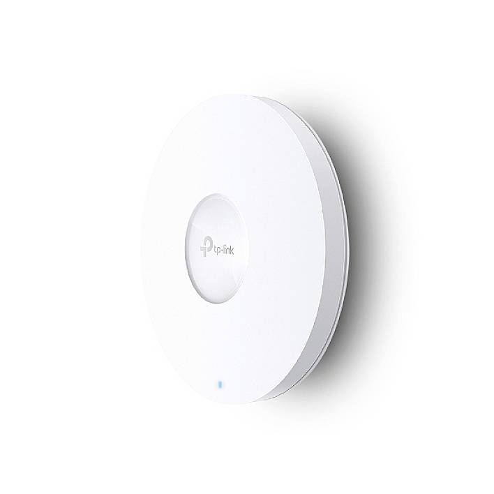 Dispositivo WLAN rotondo e bianco di TP-Link montato a parete. I LED blu indicano una connessione attiva.