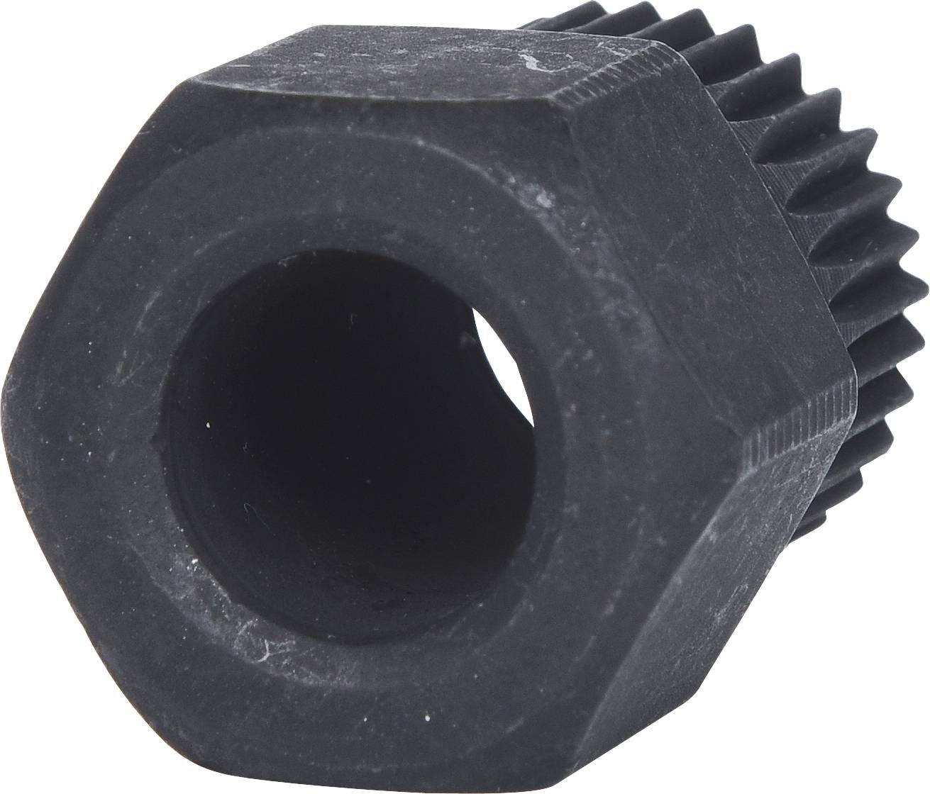 Ruota in plastica nera esagonale con denti su un'estremità. Utilizzata come pezzo di ricambio o componente in dispositivi meccanici.
