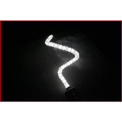 Una catena luminosa di luci LED a forma di serpentina in un ambiente buio, che emana una luce bianca morbida e illumina in modo creativo.