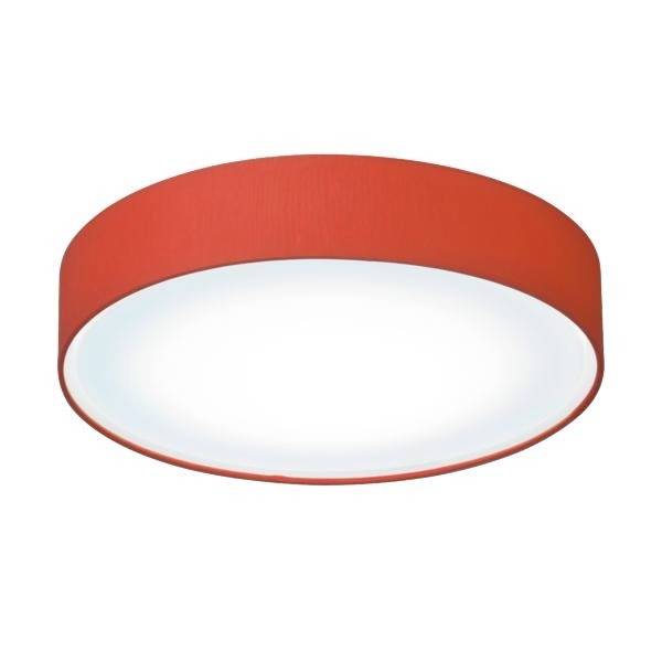 Una plafoniera rotonda di colore rosso con un elemento luminoso bianco al centro.