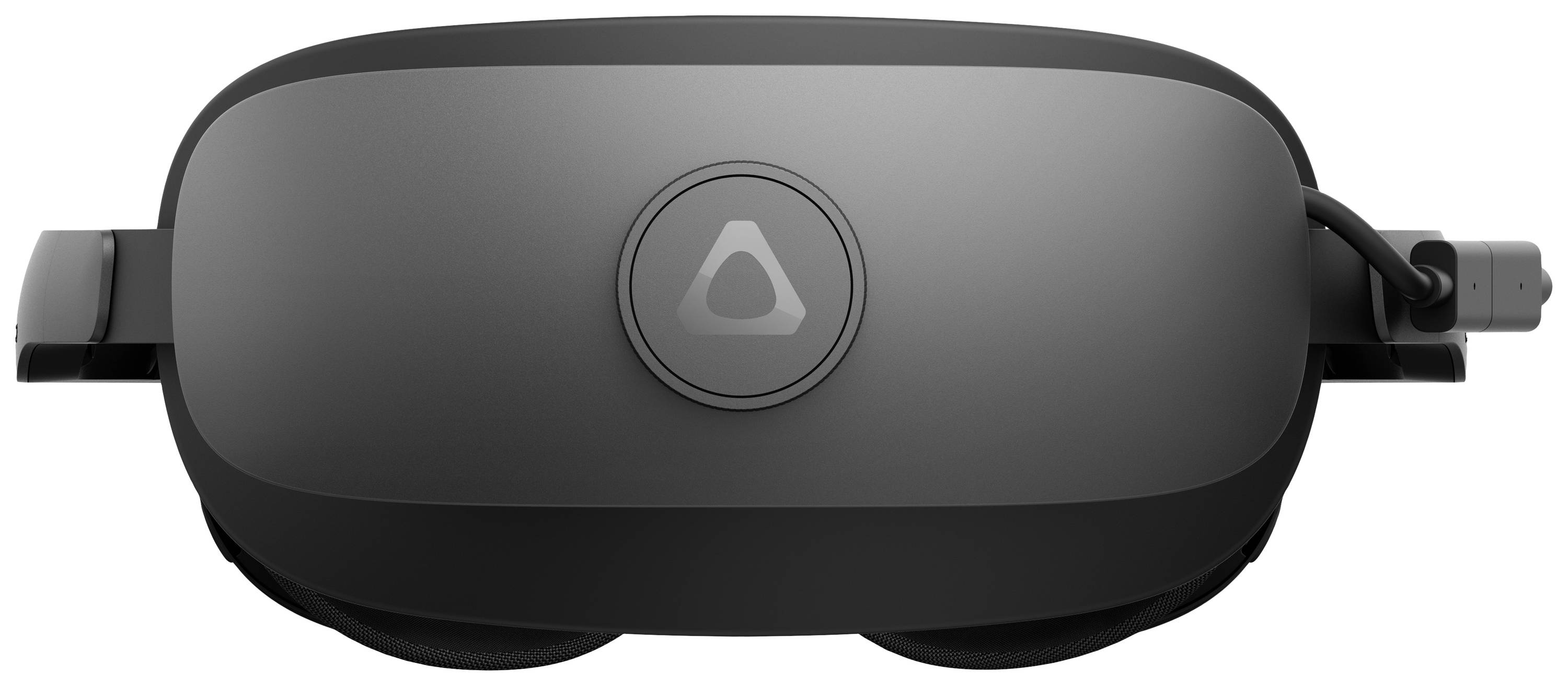 Un visore per realtà virtuale grigio con un pulsante rotondo e cavi sul lato destro, su uno sfondo semplice.