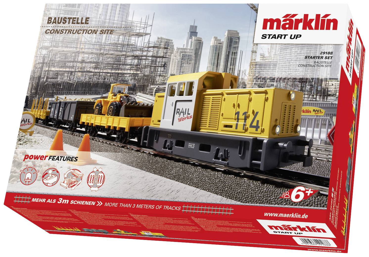 Set di trenini giocattolo 'Cantiere' per bambini dai 6 anni, con treno giallo, veicoli da costruzione e scenario di cantiere sullo sfondo.