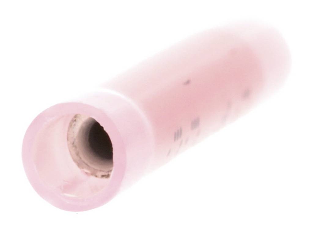 Un tubo di plastica rosa con un'apertura all'estremità, leggermente inclinato.