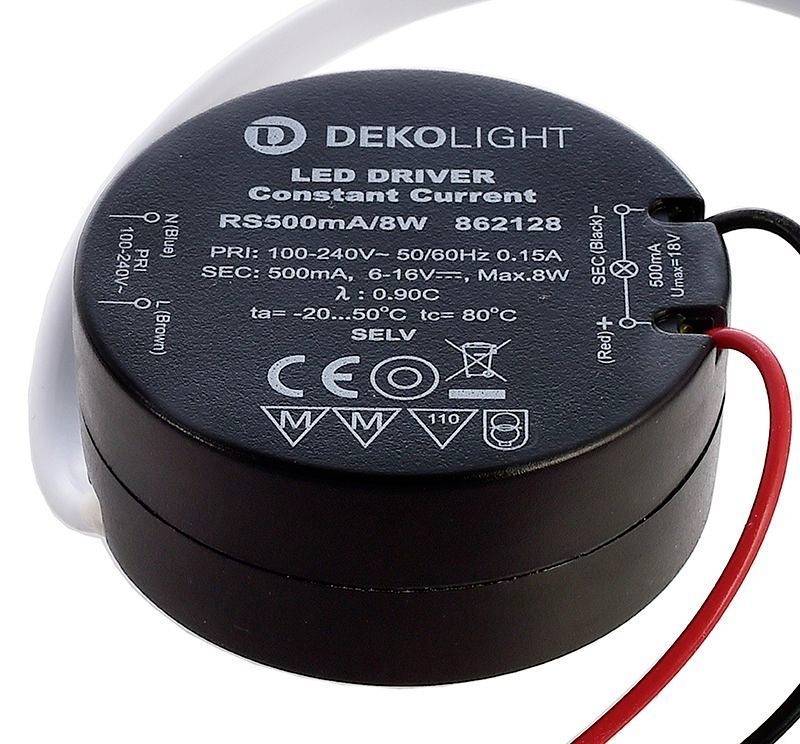 Un involucro nero rotondo per driver LED con cavi bianchi e rossi, contrassegnato da specifiche tecniche e il nome 'DEKOLIGHT'.