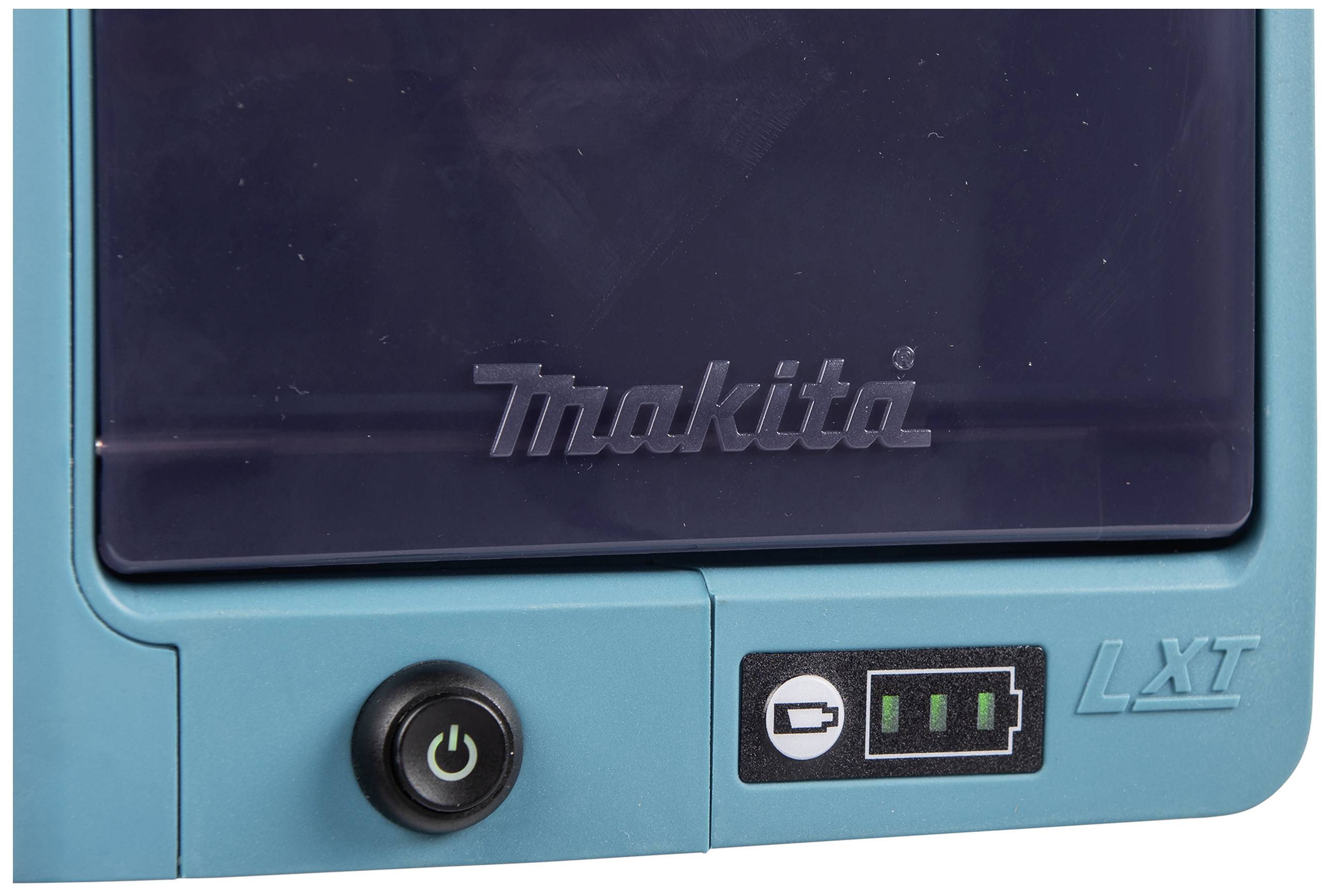 Un caricabatterie Makita blu con un interruttore di accensione/spegnimento e un indicatore LXT con simboli per mostrare lo stato di carica della batteria.