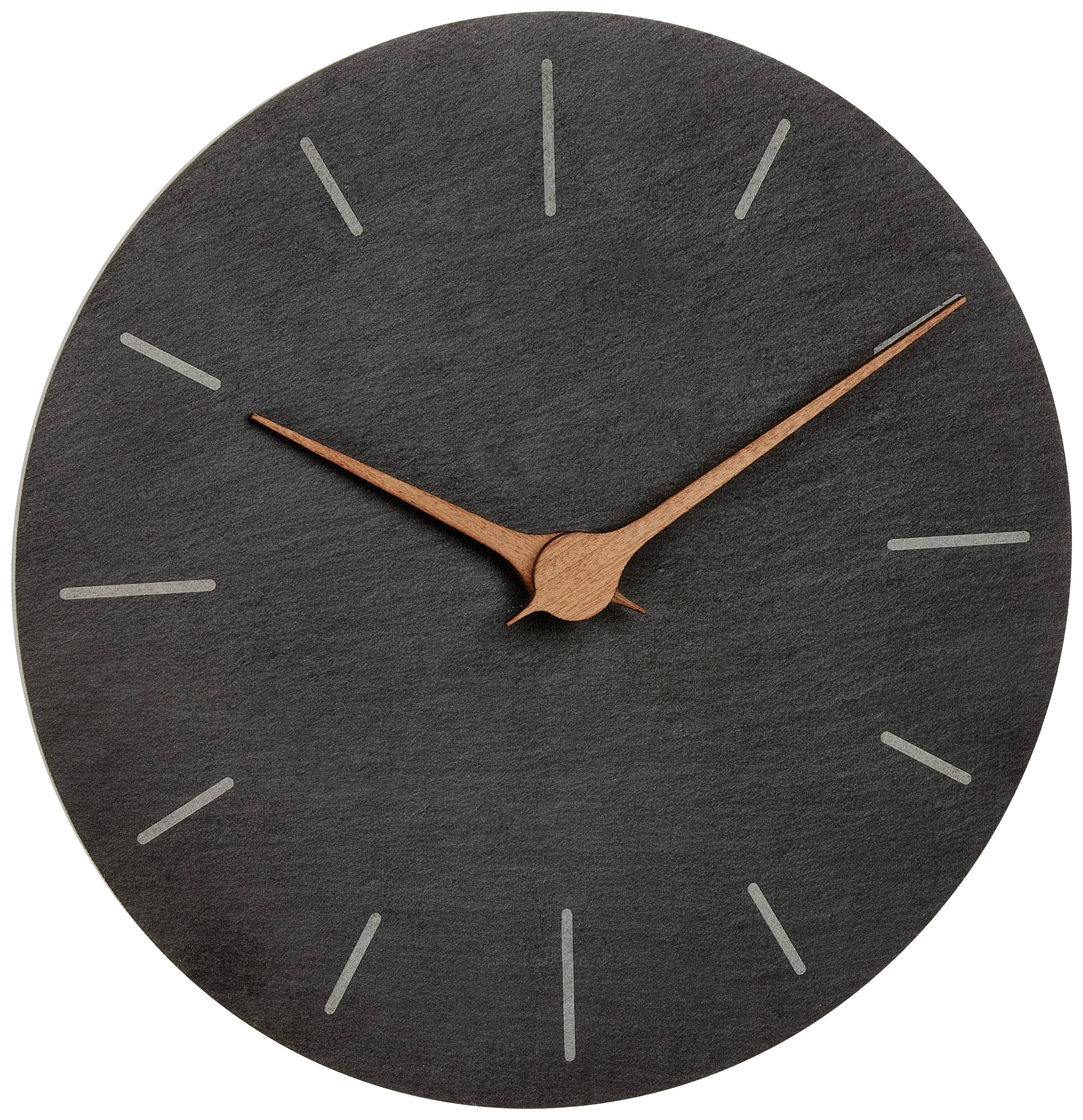 Un semplice orologio da parete con quadrante scuro e lancette color rame prive di numeri.